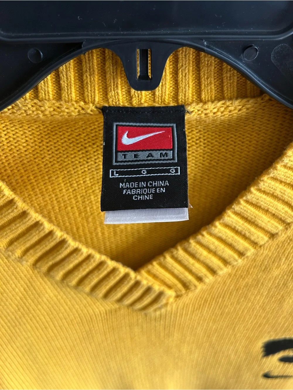 Vintage Nike Women's Gold V-Neck Sweater with Black Logo
